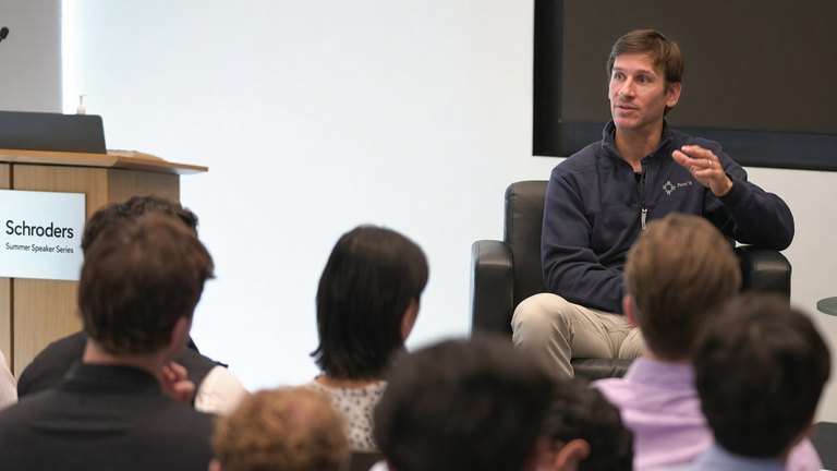 Man speaking to students