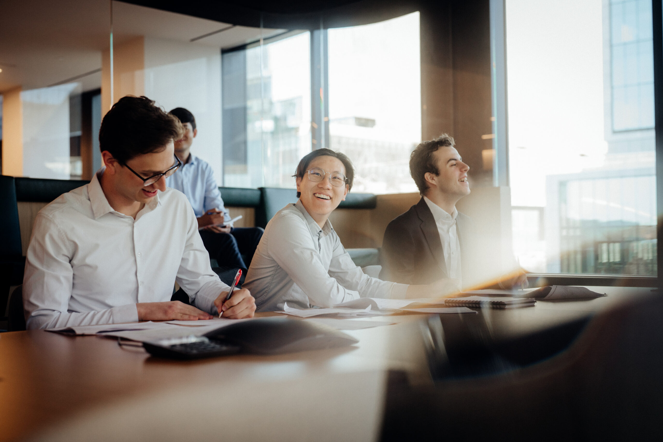 Schroders (SDR.L) interns at office conference table
